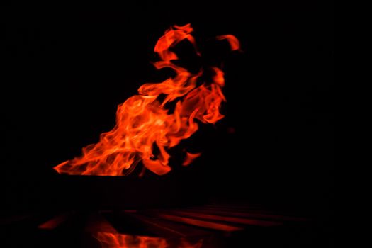 fire background blur in orange color.black background