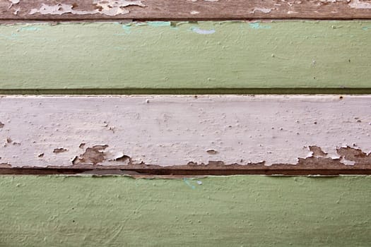 Old wood painted white and green. texture or background.