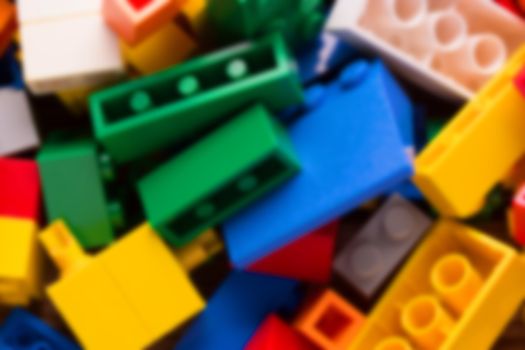 blurred red lego background. many colorful details