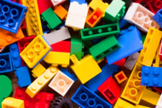 blurred red lego background. many colorful details