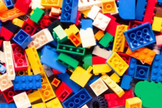 blurred red lego background. many colorful details