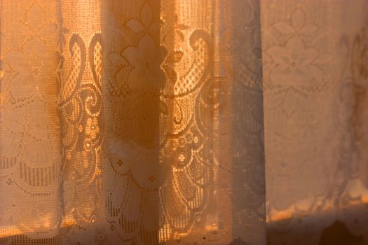 window curtain in room in morning sunlight