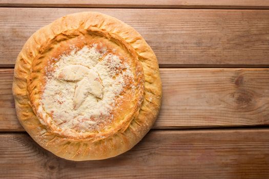 Apple pie cake lying on wooden white background