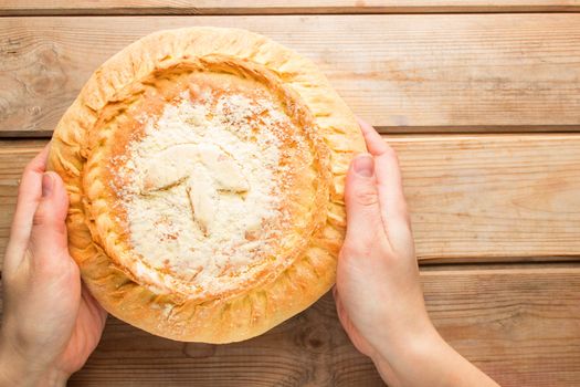 fresh baking Apple pie cake in hands