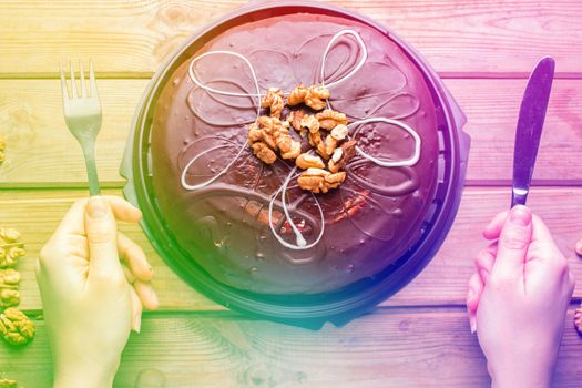 very hungry woman is ready to eat chocolate cake