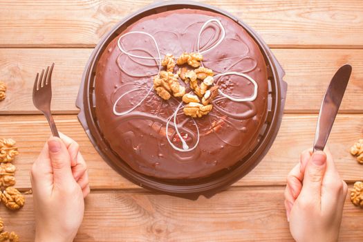 very hungry woman is ready to eat chocolate cake