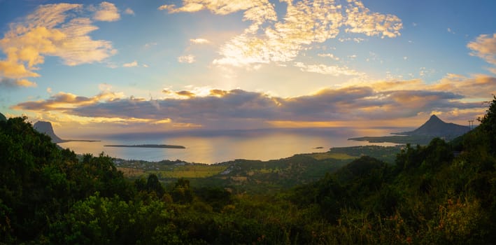 View from Piton de la Petite Riviere Noire, highest peak of Mauritius. Panorama at sunset.Le Morn Brabant on background.