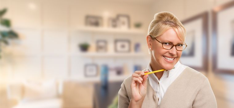 Beautiful Expressive Student or Businesswoman with Pencil in Office.