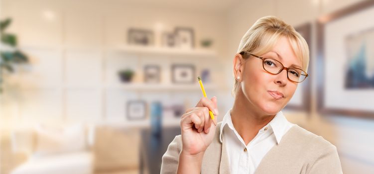 Beautiful Expressive Student or Businesswoman with Pencil in Office.