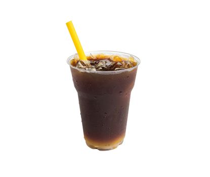 Closeup ice of americano coffee with yellow straw on white background