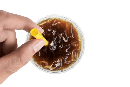 Closeup top view hand hold ice of americano coffee with yellow straw on white background