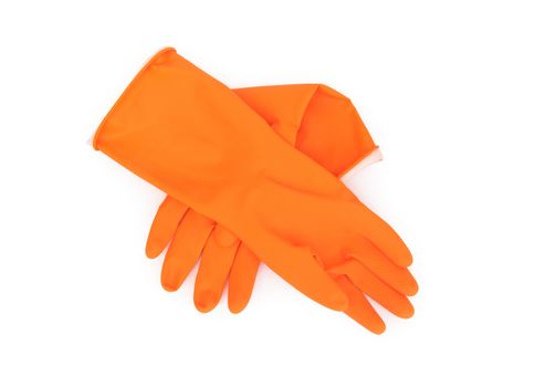 Orange color rubber gloves for cleaning on white background, housework concept