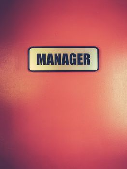 Retro Style Manager Sign On A Door At A Motel With Copy Space