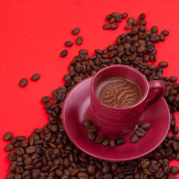 coffee cup with coffee beans on a red background