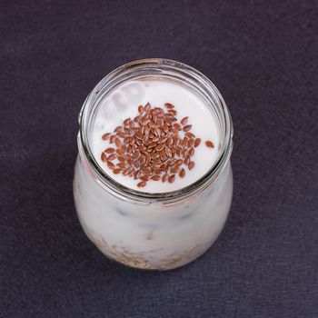 Healthy breakfast - yogurt with blueberries and muesli served in glass jar, Lazy oatmeal