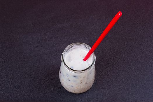 Healthy breakfast - yogurt with blueberries and muesli served in glass jar, Lazy oatmeal