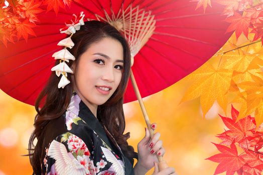 Asian woman wearing kimono in autumn.
