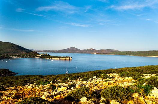 Landscape of the gulf of capo caccia from the Cave of broken vessels at sunset