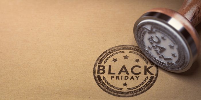 Rubber stamp with the text Black Friday stamped over cardboard background. Sales concept.3D illustration.