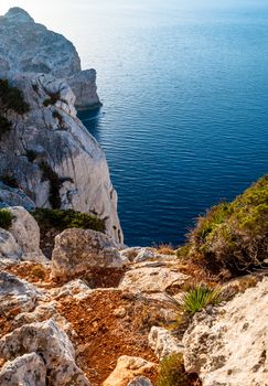 Landscape of the gulf of capo caccia from the Cave of broken vessels at sunset