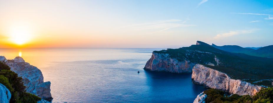 Landscape of the gulf of capo caccia from the Cave of broken vessels at sunset