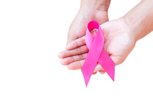 Woman hand hold pink ribbon on white background ,Awareness breast cancer concept