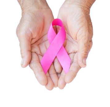 Closeup Old woman hand holding pink ribbon on white background ,Awareness breast cancer concept