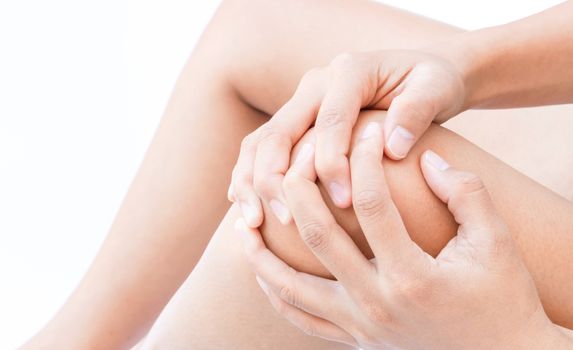 Closeup woman hand hold knee with pain symptom, health care and medical concept