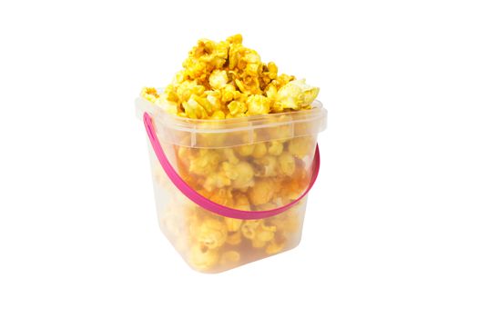 Popcorn in plastic bucket on white background