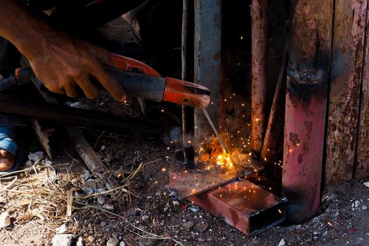 Arc welding and welding fumes, Worker welding on steel in the job site.