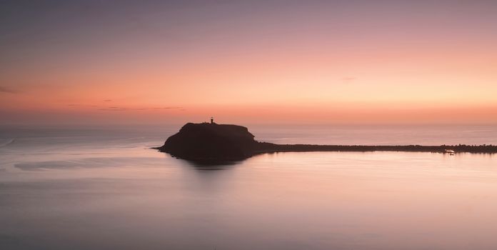 Vews of Barrenjoey Headland, Pittwater, Palm Beach, Australia taken at dawn with some  mystical sea fog and long exposure creating smooth water effect but still keeping the flow to captivate the viewer.