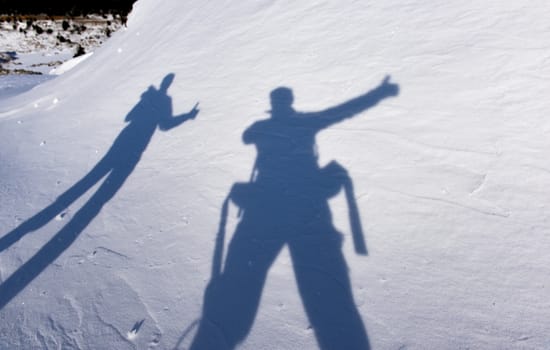 shadows of adventurous climbers