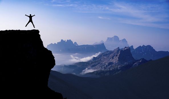 Happy and free at the peak of the mountains