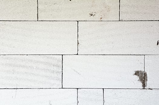 Texture of a wall made from white aerated concrete blocks.