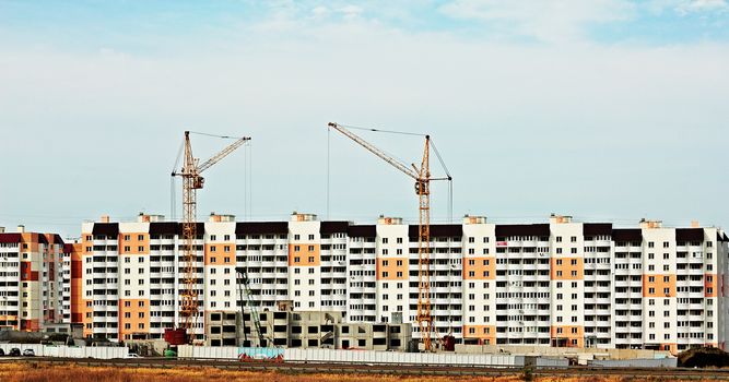 View of new buildings and construction of a multi-storey residential building.