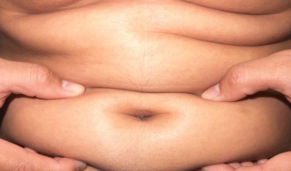 Closeup of abdominal surface woman fat, healthy care and beauty concept