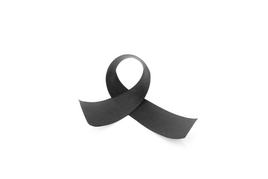 Black ribbon symbol for mourning on white background