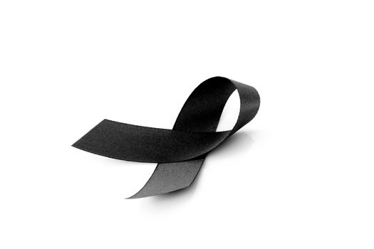 Black ribbon symbol for mourning on white background