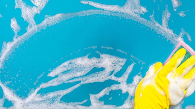 Cleaning conept, hand cleaning glass window pane with detergent and wipe or sponge