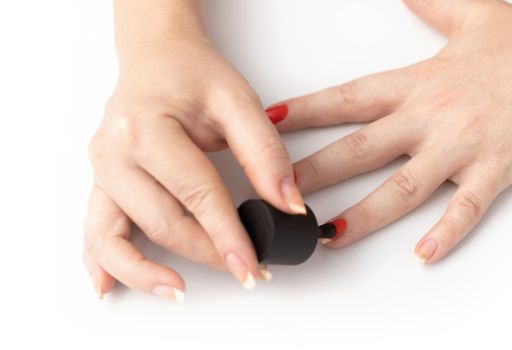 hand care, nail painting with red lacquer