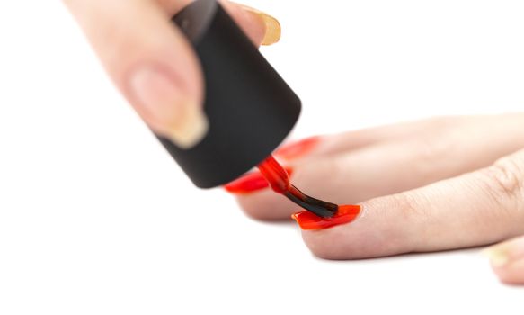 hand care, nail painting with red lacquer