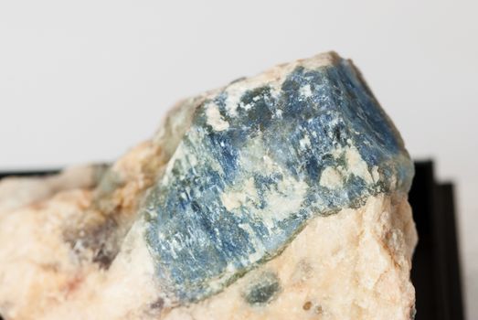 Specimen collectible of blue corundum Sapphire crystal in matrix close-up, Ural