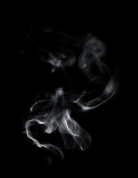 Abstract defocused white smoke on black background