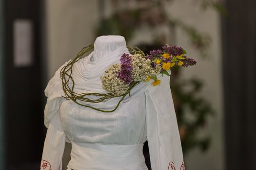 traditional costum with decoration of flowers, note shallow depth of field