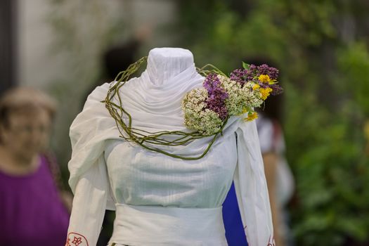 traditional costum with decoration of flowers, note shallow depth of field