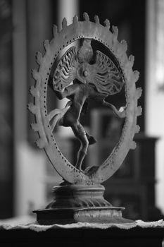 A view of an antique Natraj god sculpture from the rear view.