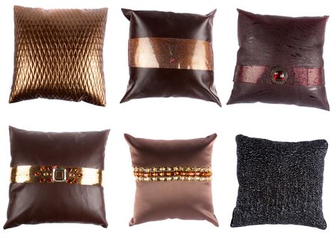 A set of beautiful designer pillows with inticrate designs, on white studio background