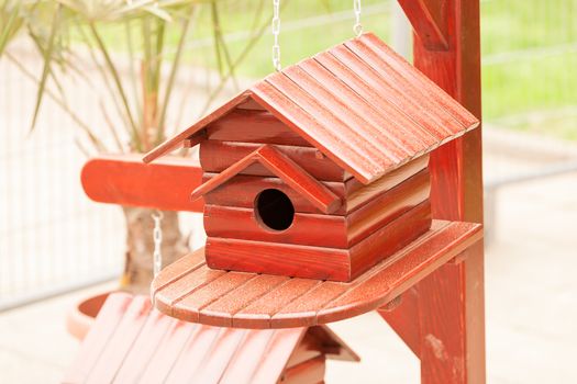 handmade wooden birdhouses, note shallow depth of field