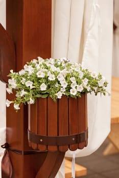 Hanging wooden flower arrangement at the entrance, note shallow depth of field