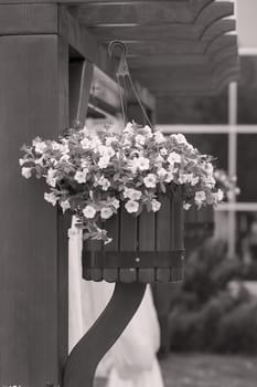 Hanging wooden flower arrangement at the entrance, note shallow depth of field